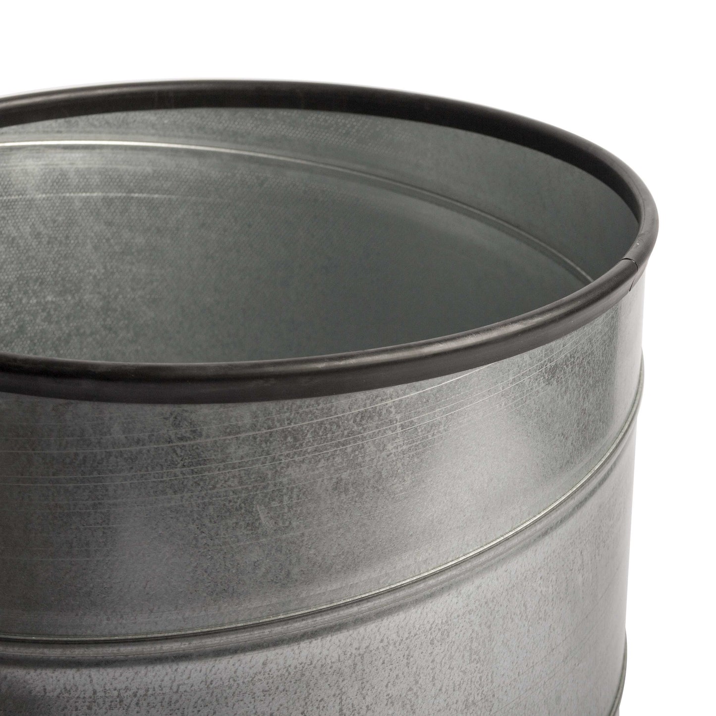 Close-up of a galvanized trash can with a black rim on a white background