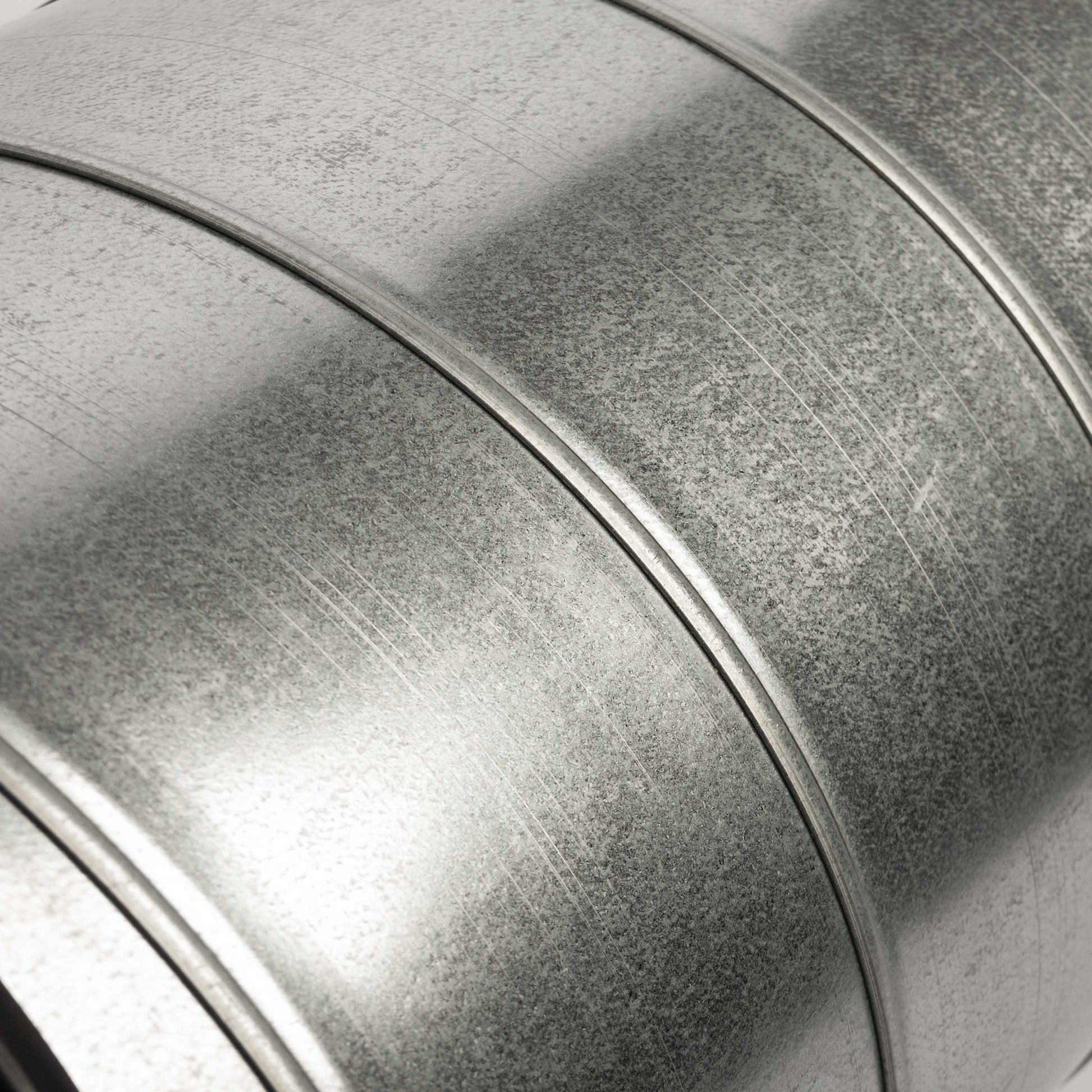 Close-up of a spiral pipe galvanized trash can with a textured surface